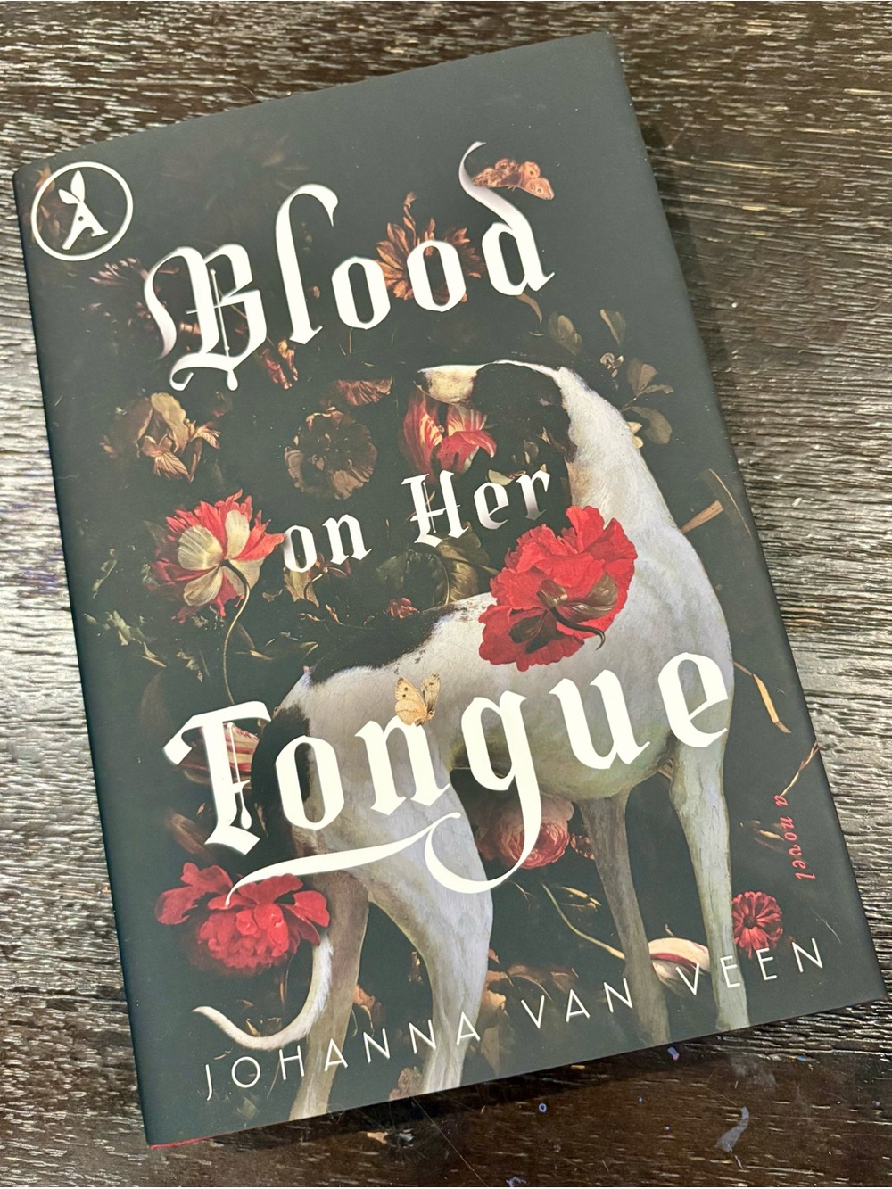 Blood on Her Tongue— Black Floral Hardcover Jacket